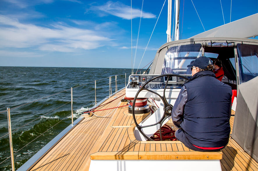 Cinematic shot of an owner sailing S/Y Bellkara in the Baltic Sea